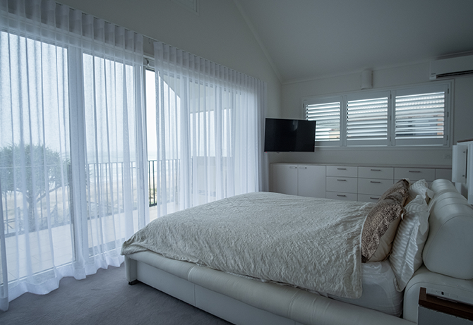 White bedroom with white curtains | Featured image for Bedroom Window Coverings Landing Page for U Blinds Australia.