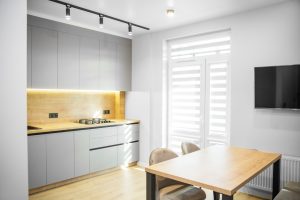 Bright modern kitchen with natural light | Featured image for Kitchen Window Coverings Landing Page for U Blinds Australia.