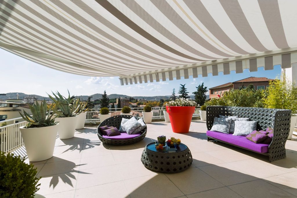 Exterior of a Modern Terrace with Furnishings | Featured image for Most Popular Awning Styles Blog by U Blinds Australia