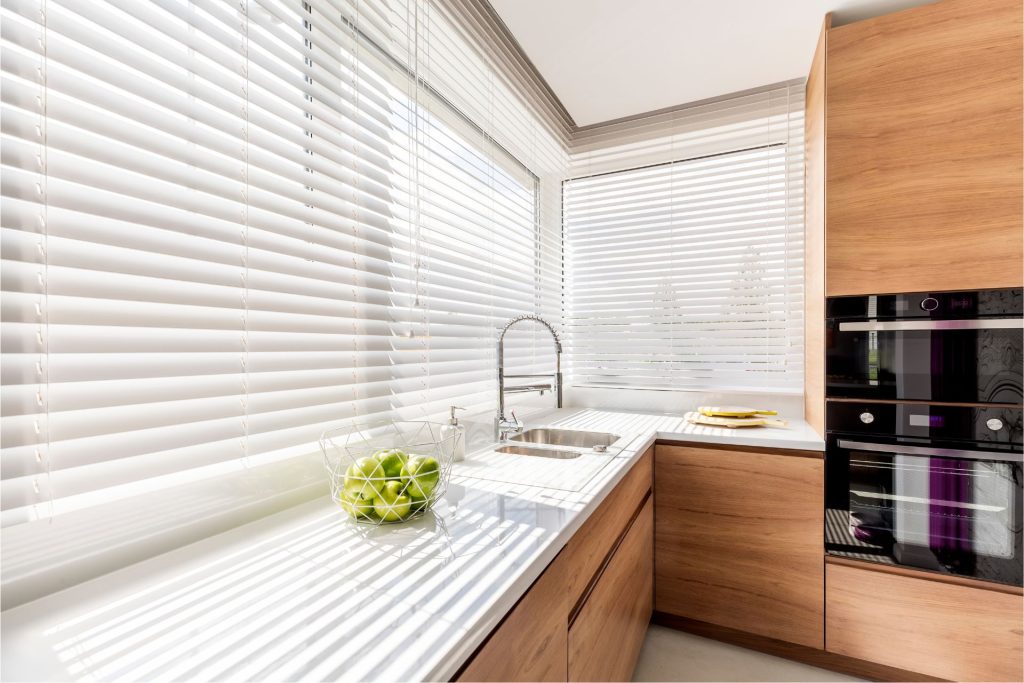 Image of Modern White Kitchen • | Featured image for the Blinds for Summer blog from U Blinds Australia.