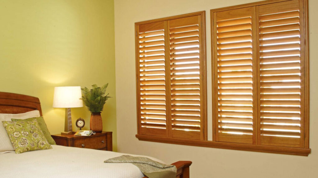 Bedroom with wood shutters | Featured image for the top level Shutters page for U Blinds Australia.