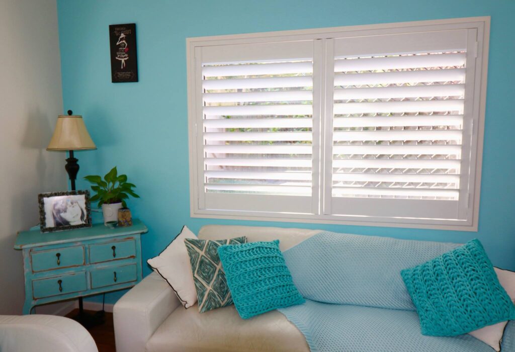 Light teal coloured room with a white shutters | Featured Image for the Adelaide Loaction Page of U Blinds Australia.